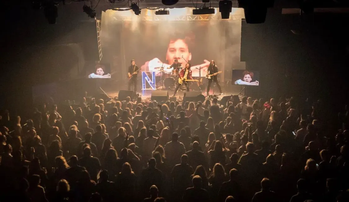 Live cover band performing rock and pop hits at a Toronto corporate gala