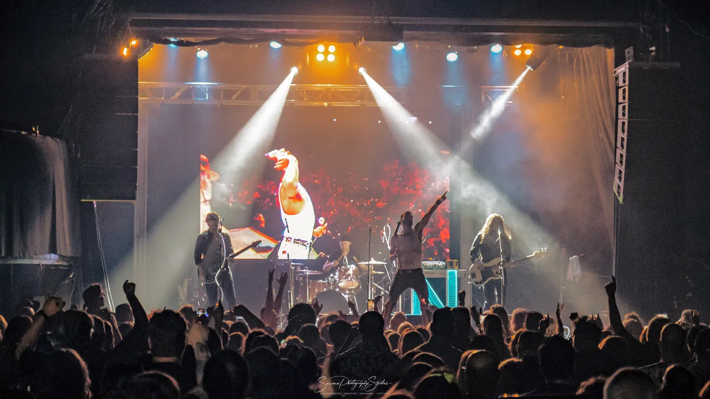 Neon Nostalgic 80s 90s cover band performing live in Toronto with synchronised music videos behind the band