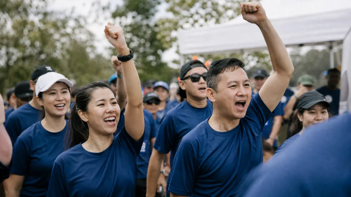 Community charity fun run participants cheering at the start line