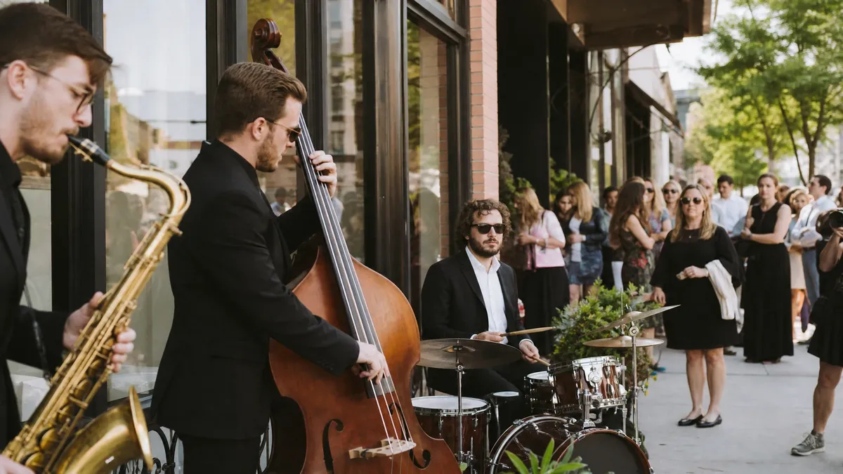 Live band performing outside a new business on opening day