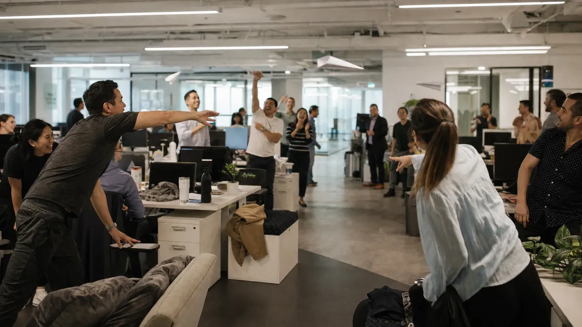 Paper airplane contest icebreaker across an open plan office