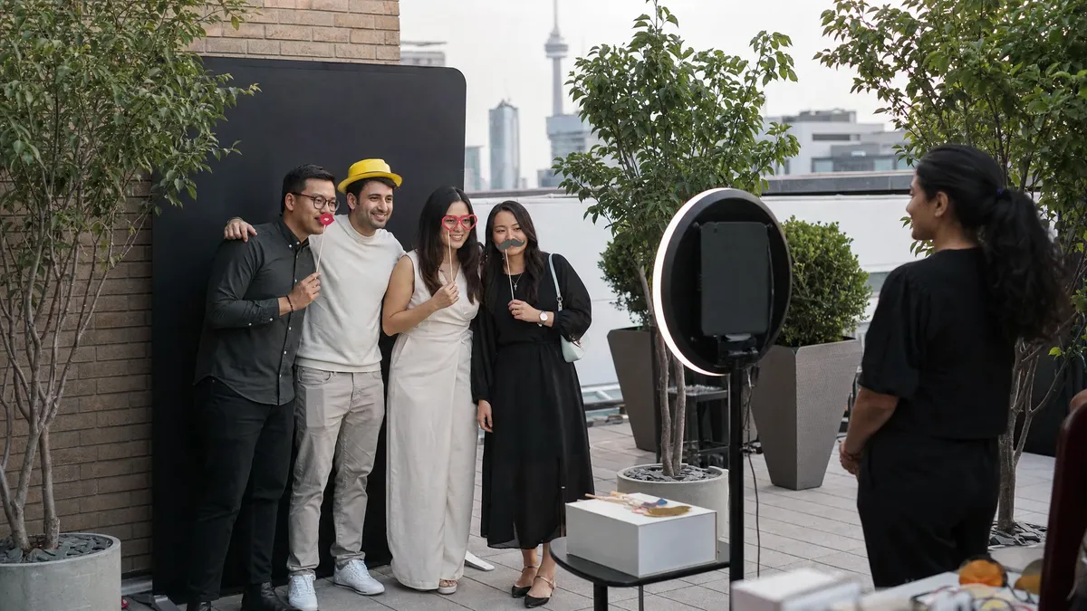 Open-air photo booth rental setup at a Toronto event venue with guests posing