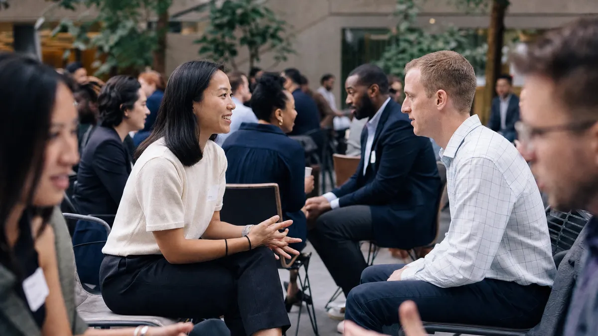 Cross-department speed networking rotation in an office atrium