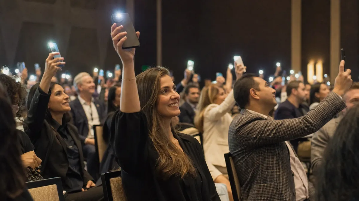 Audience voting on their phones during a live corporate game